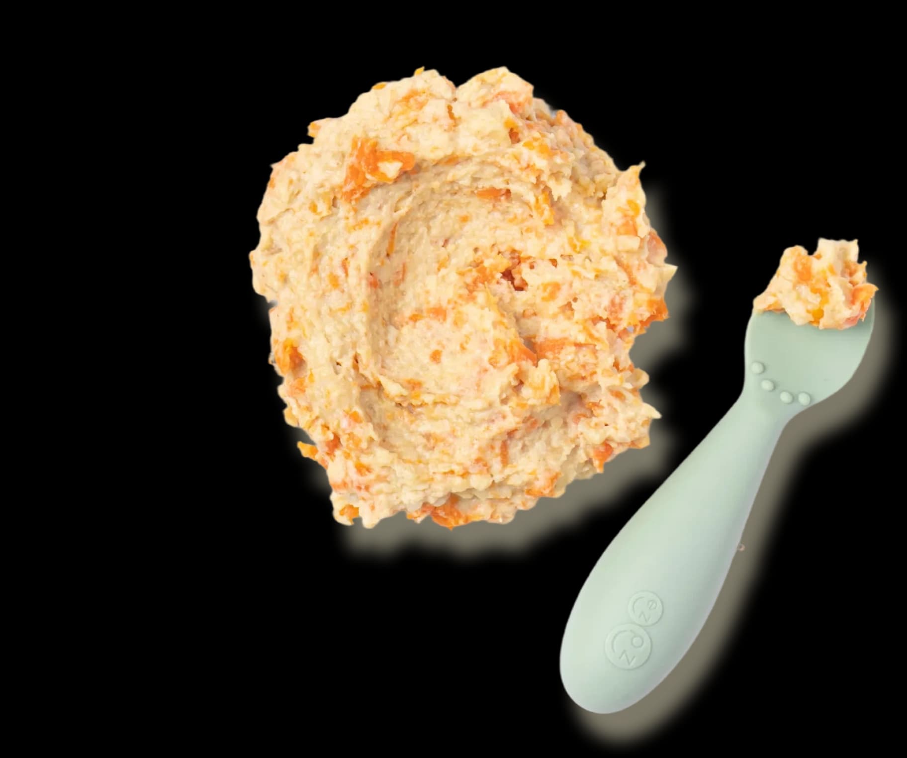 Bowl of creamy carrot purée with spoon