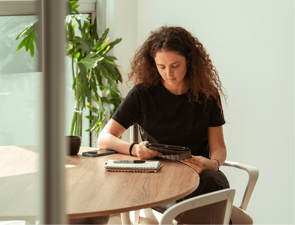 Person sitting with an ipad 